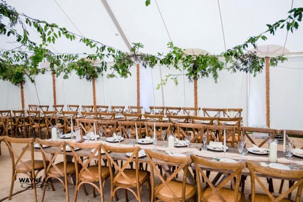 Long tables inside traditional tent